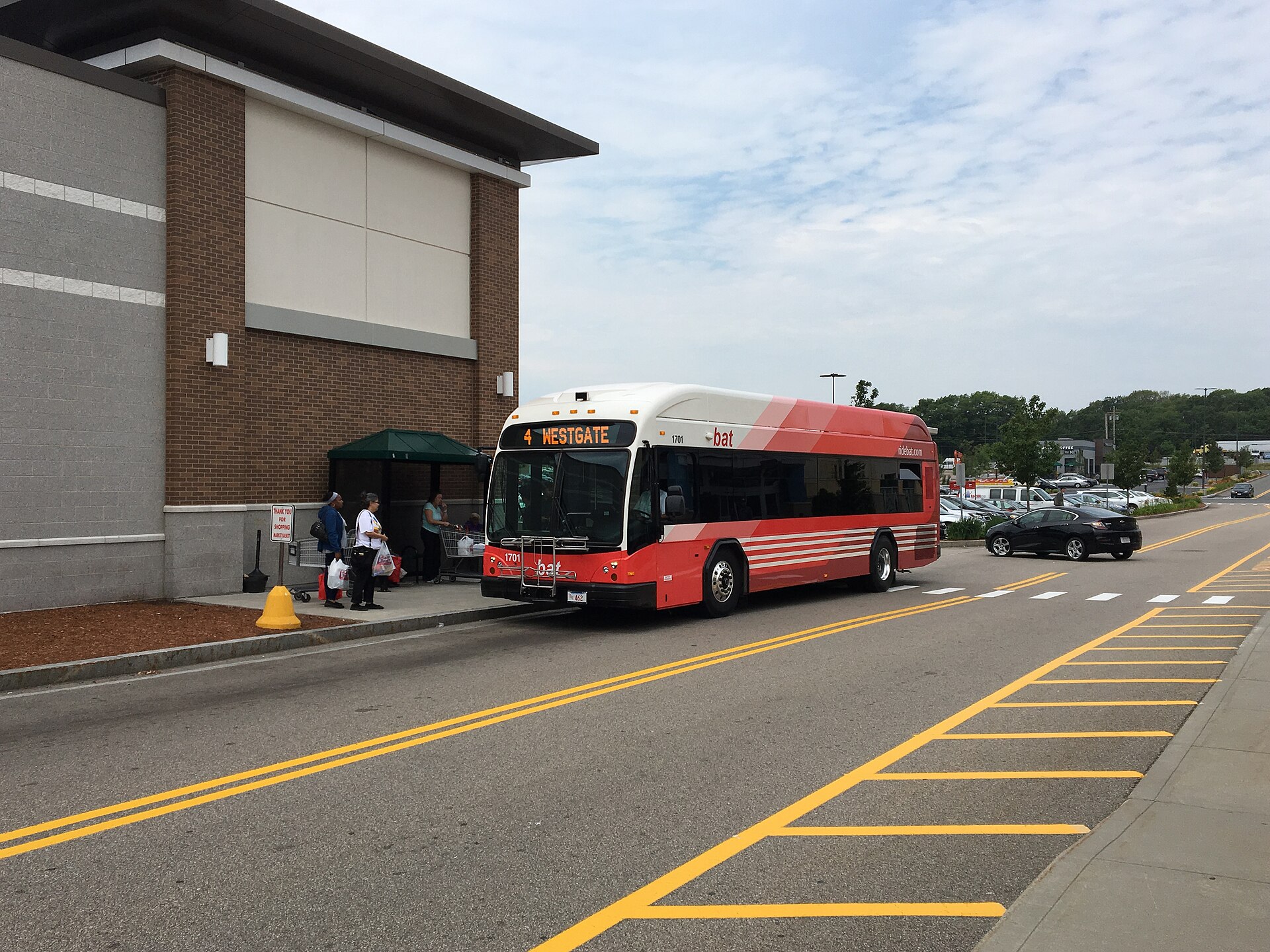 A red BAT Route 4 bus stopped at Westgate Mall